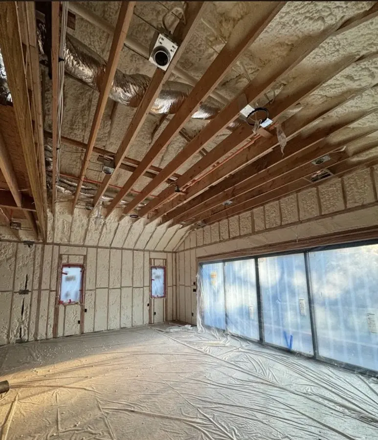 Interior walls and ceiling insulated with spray foam during new construction in Akron